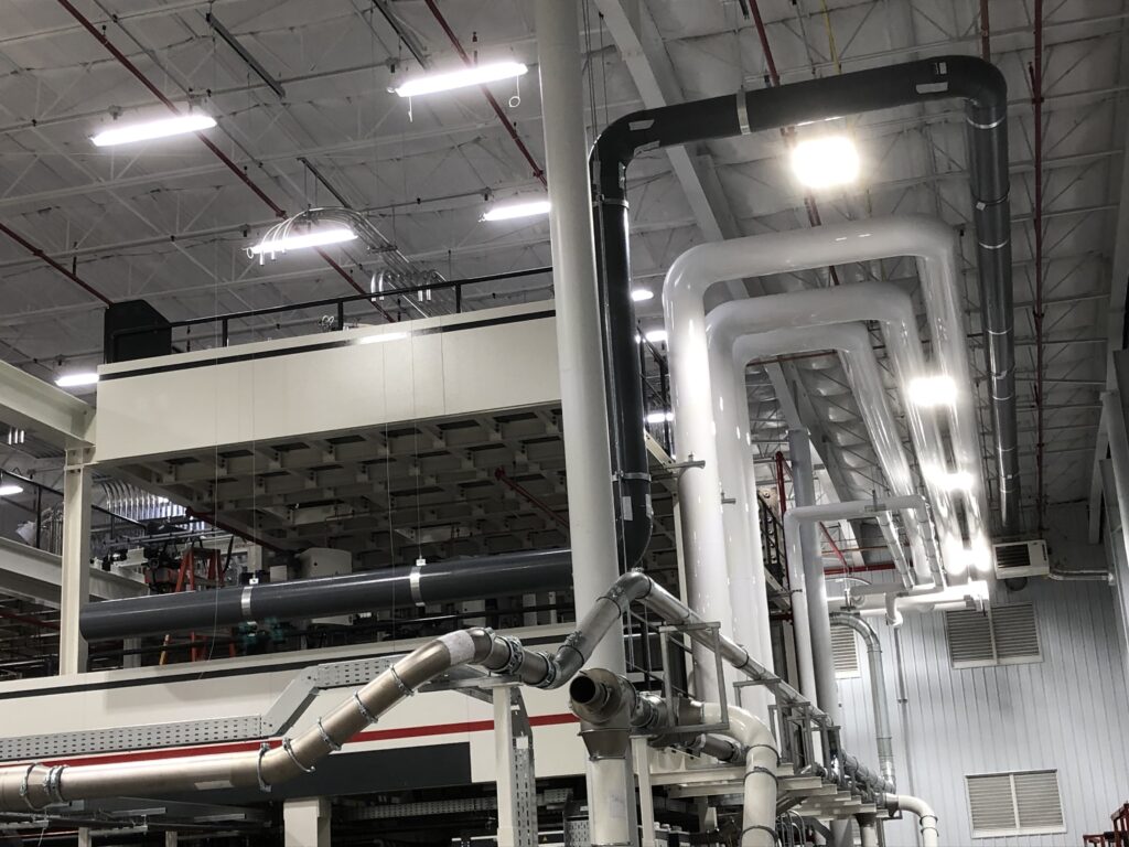 black and white pipes inside of building